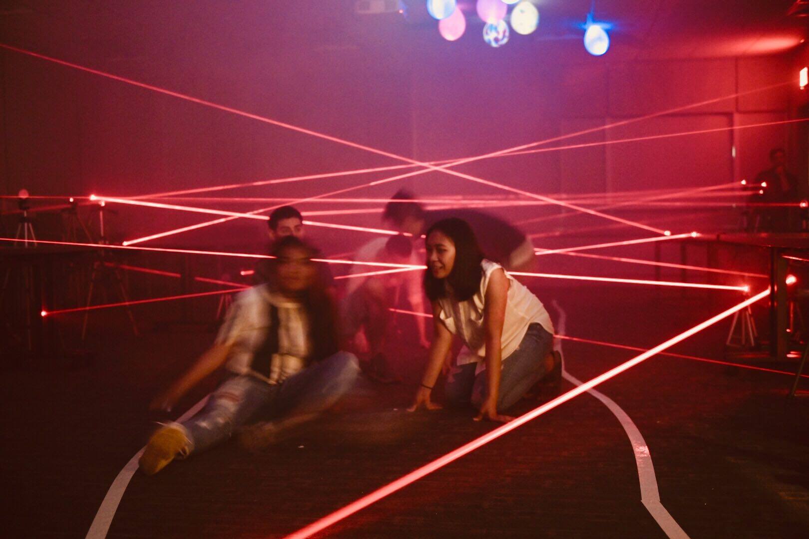 image of students trying to dodge laser beams