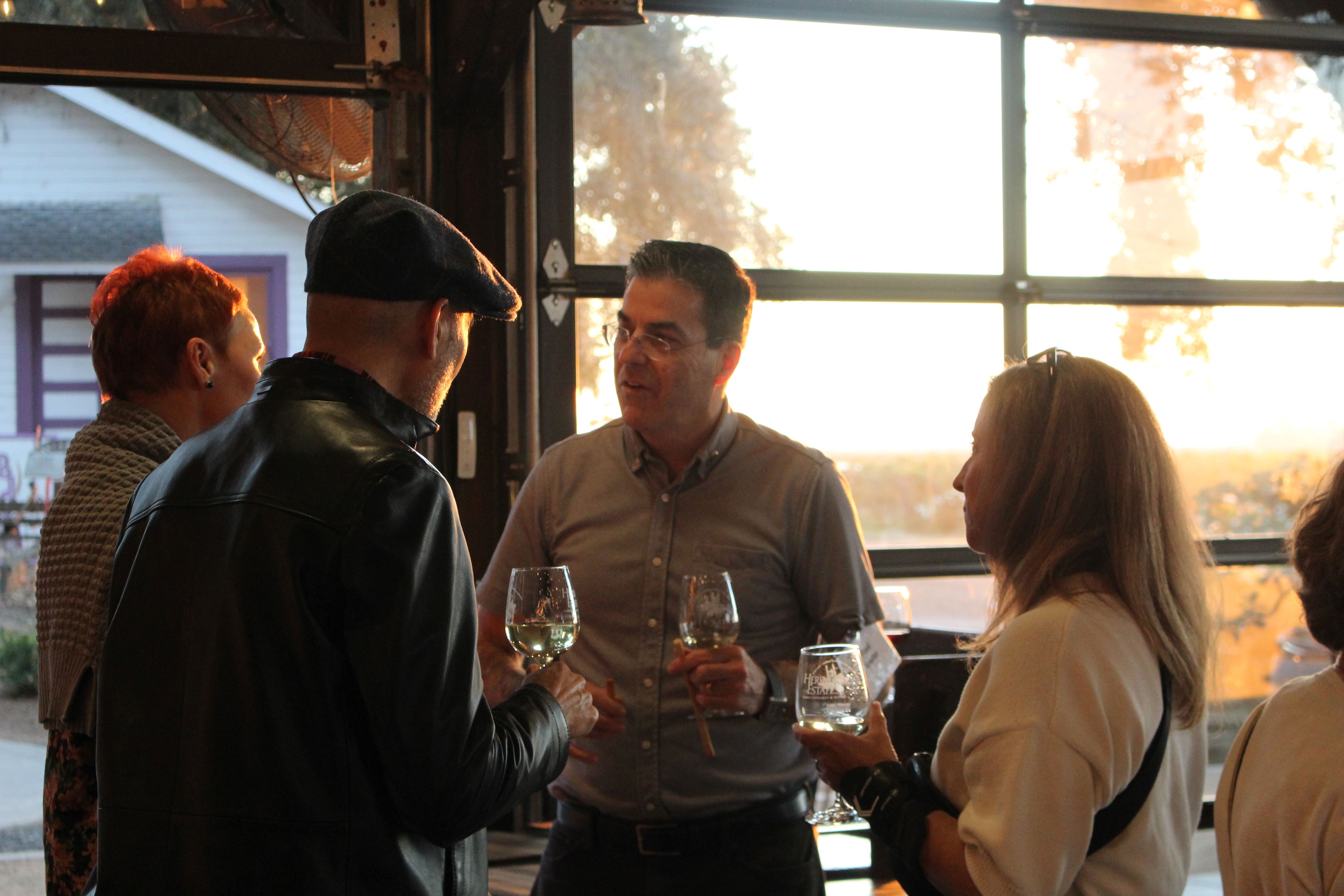 Man Talking to Two Other People 