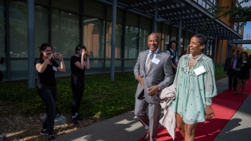 Chancellor Gary May and LeShelle May walking down the red carpet.