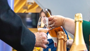 Aggies Uncorked pouring in lobby