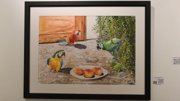 A watercolor painting of three exotic birds around a plate of food.
