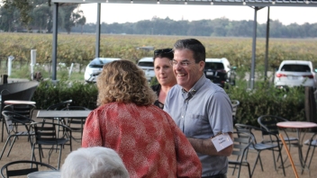 Man smiling and laughing with woman. 