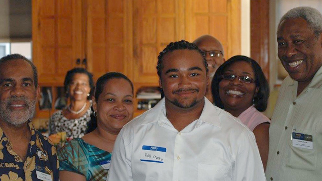 UC Davis freshman Kirk Crump and members of the UC Davis Cal Aggie African and African American Alumni Association (5A)