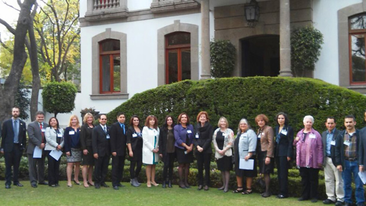 Chancellor Katehi stands with UC Davis alumni outside Casa de California in Mexico City