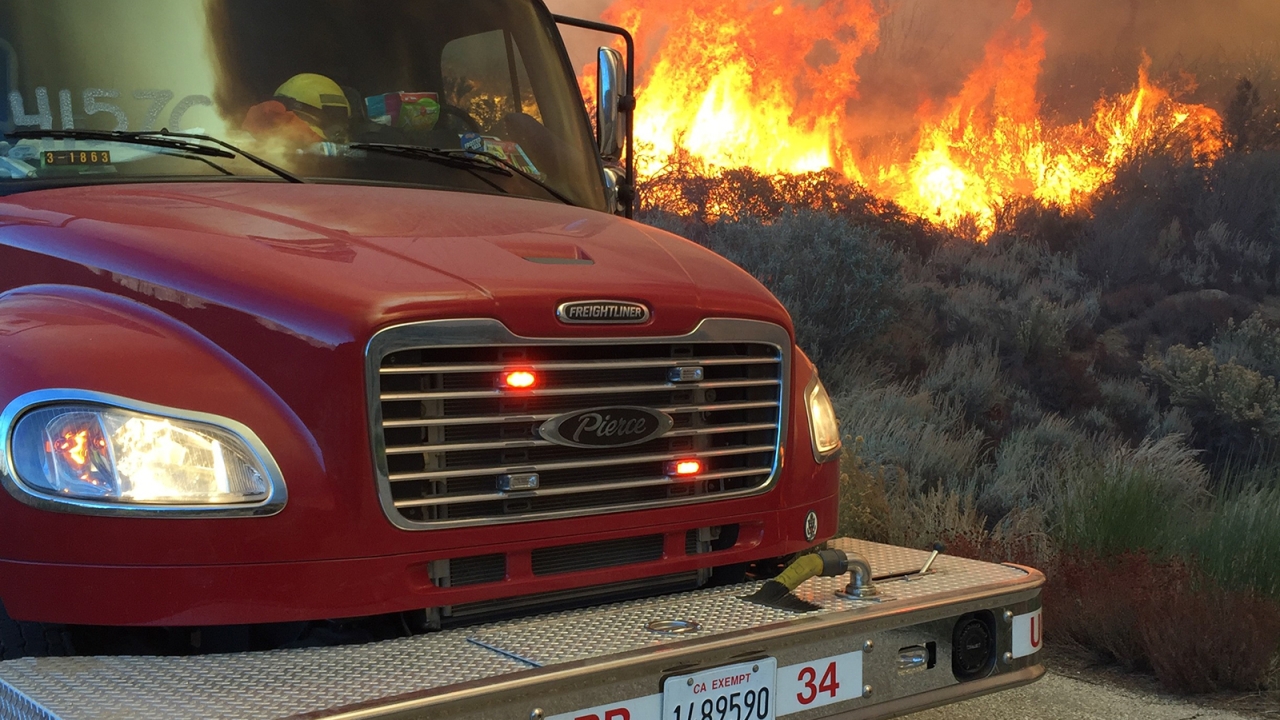 Firetruck in front of forest fire