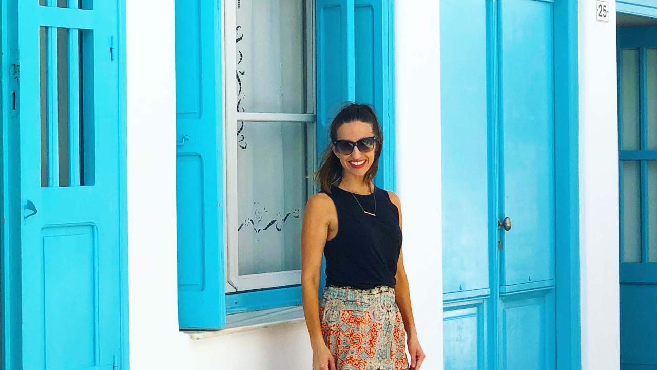Angela Blanchard recently went on a government trip to Nepal. Her passion for traveling has inspired and influenced her career as a lobbyist. Angela Blanchard in front of a white wall with blue windows
