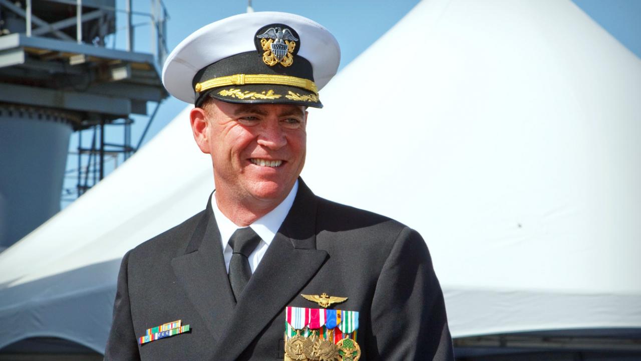 Kevin Couch in Navy uniform outside