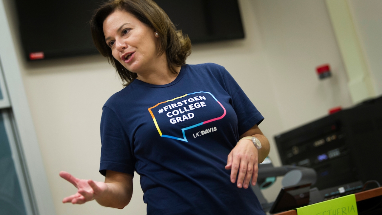 A first-generation faculty member talking and gesturing hands