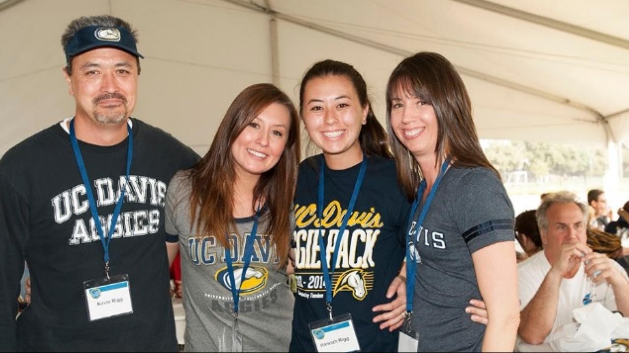 Picture of four people wearing UC Davis t-shirts.