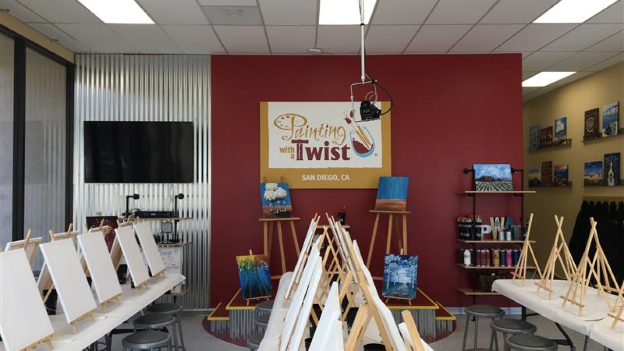 Painting with a Twist workshop with easels and paint canvases set up