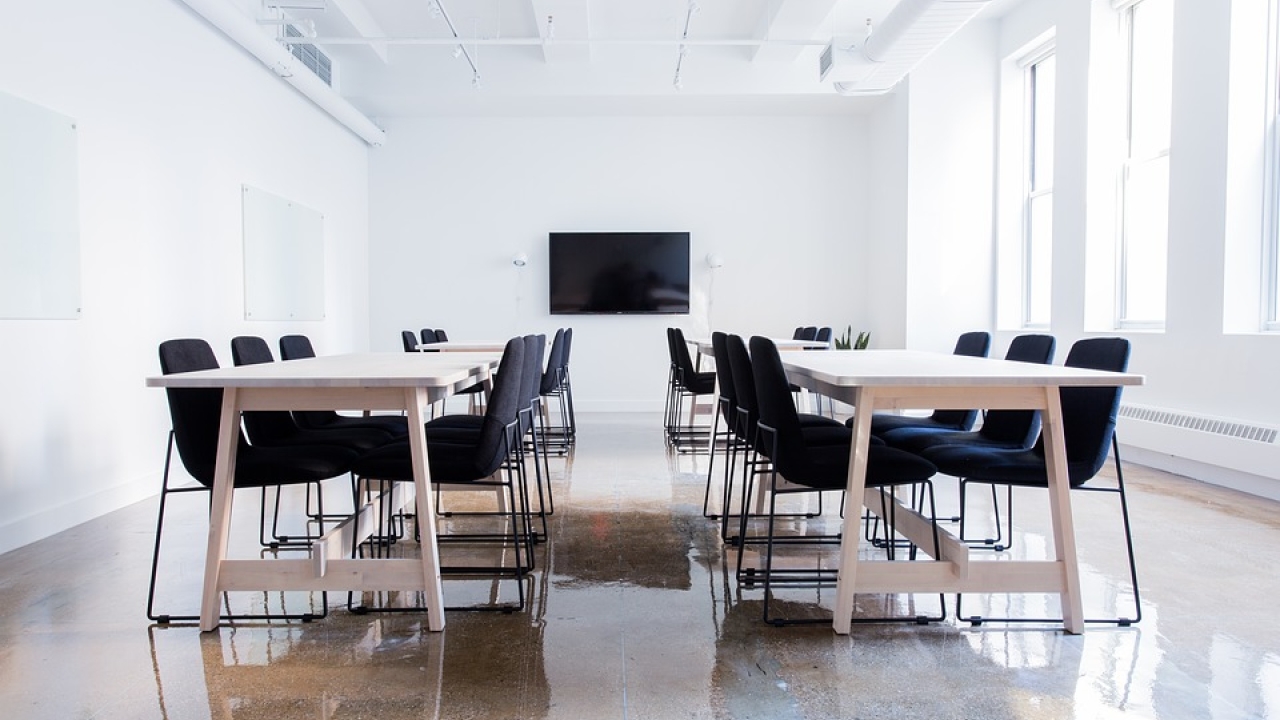 Chairs around tables in a conference room