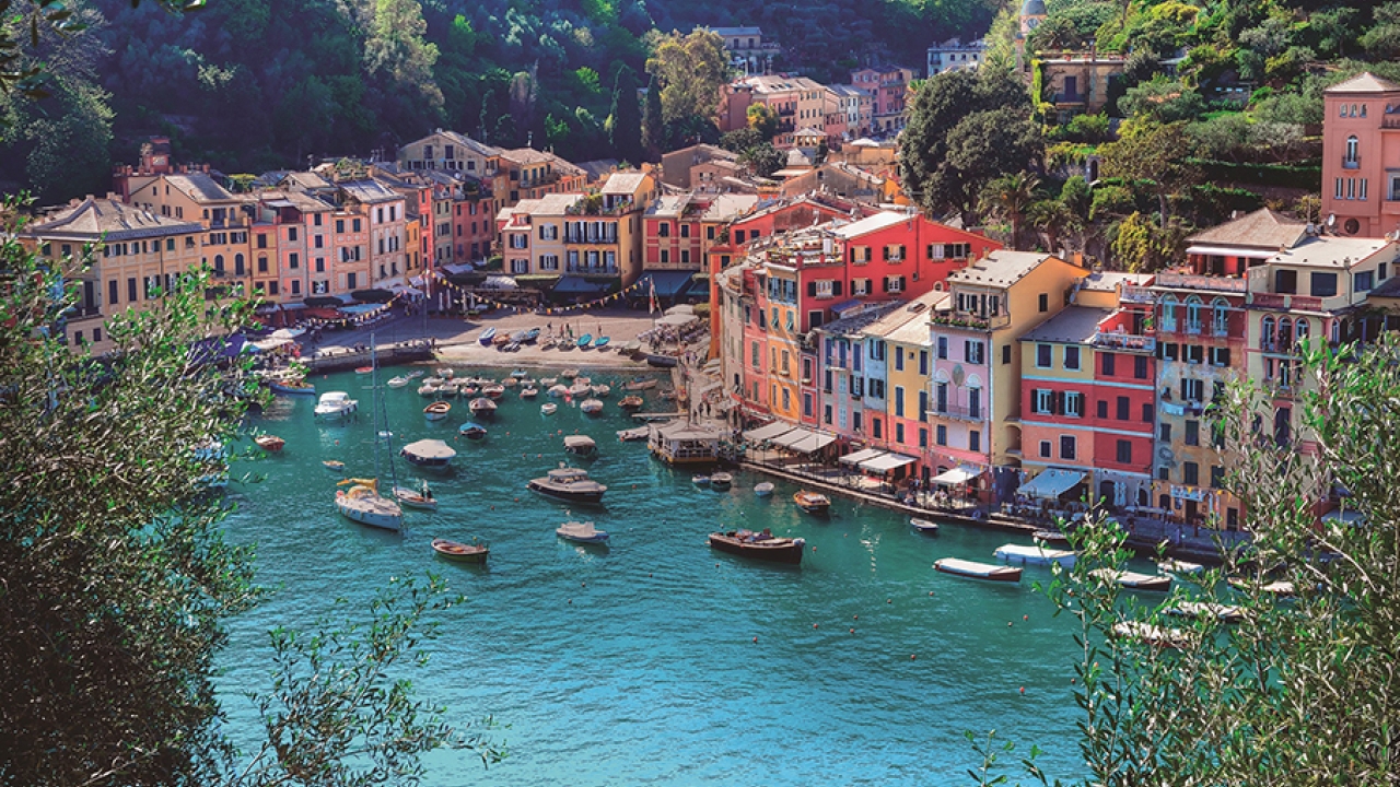 River with colorful, tall houses along the side of it