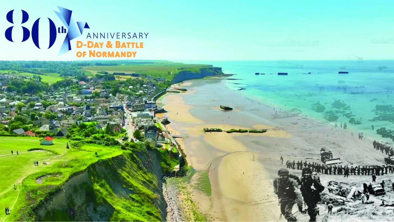 Beach with soldiers and neighboring town