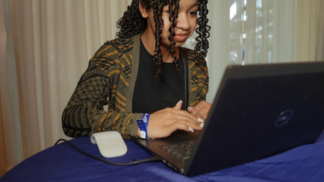 A girl working on a laptop