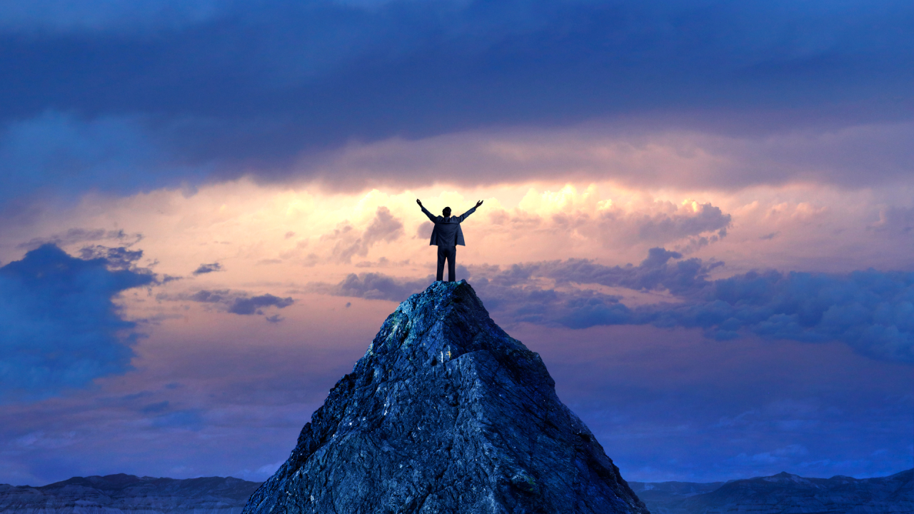 A person at the summit of a mountain