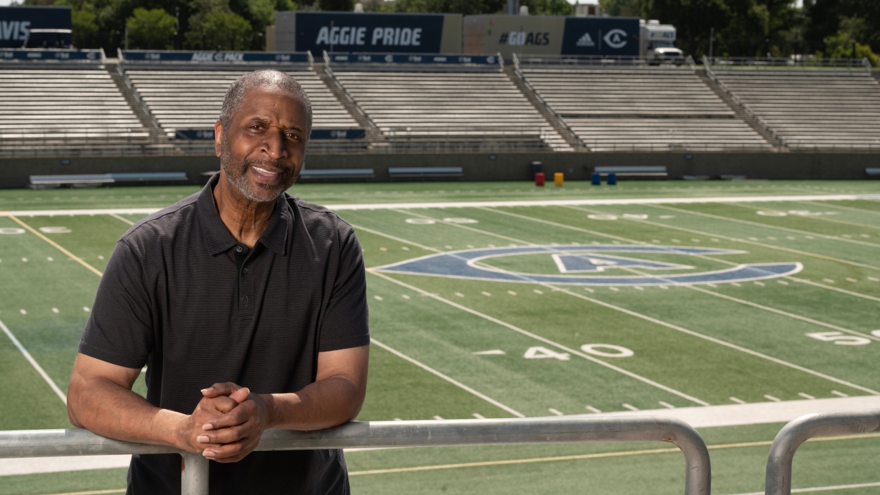 Ron Austin poses in the stands of the UC Davis football stadium.