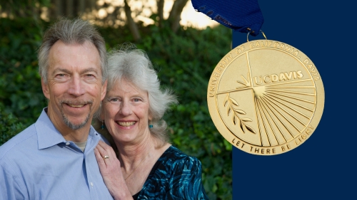 UC Davis Medal recipients Karl Gerdes and Pam Rohrich, couple, portrait. Gold medal is visible on the right-side.