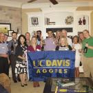 Houston Aggies holding up a UC Davis flag 