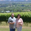 John Bucher '84 and his wife Diane of Bucher Wines posing in front of their vineyard