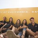 Students in front of a UC Davis sign