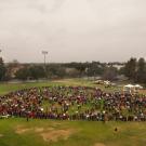 An aerial shot of a group of people forming a heart at Hutchison Field