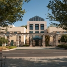 A front view of the Walter A. Buehler Alumni Center on a sunny day.