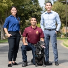 From left to right: CORE Officers Jenna Du ’15, Tabbasum Malik ’19 with K-9 Charlie, and Ricky Lee ’16.