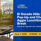 Set table with uc Davis alumni sign on it next to event text