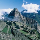 An aerial view of the Machu Picchu ruins in the lush mountains of Peru.