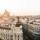 Photo of the Madrid skyline with event info on the side