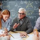 image of a professor talking with students