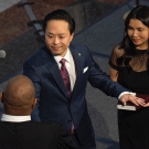 Thien Ho takes his oath of office standing beside his wife, Jenny, whom he met as an undergraduate at UC Davis.