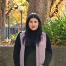 Mariel Becerra Arellano standing outdoors in the fall at UC Davis