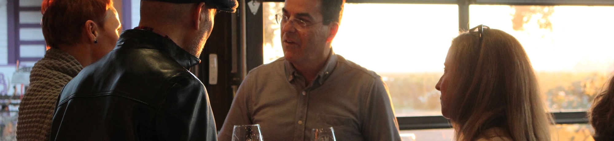 Man Talking to Two Other People 
